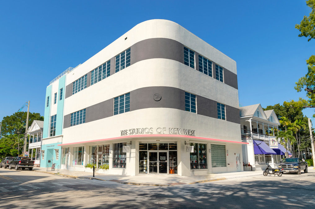 Image of The Studios of Key West building and iconic, curved corner.
