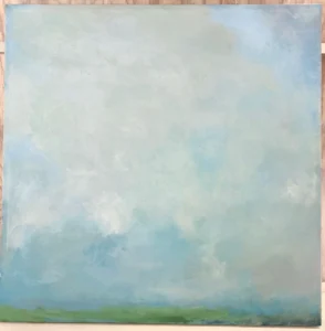 Abstract landscape painting with a soft, cloudy blue-and-white sky filling most of the canvas above a thin strip of green grass along the bottom edge.