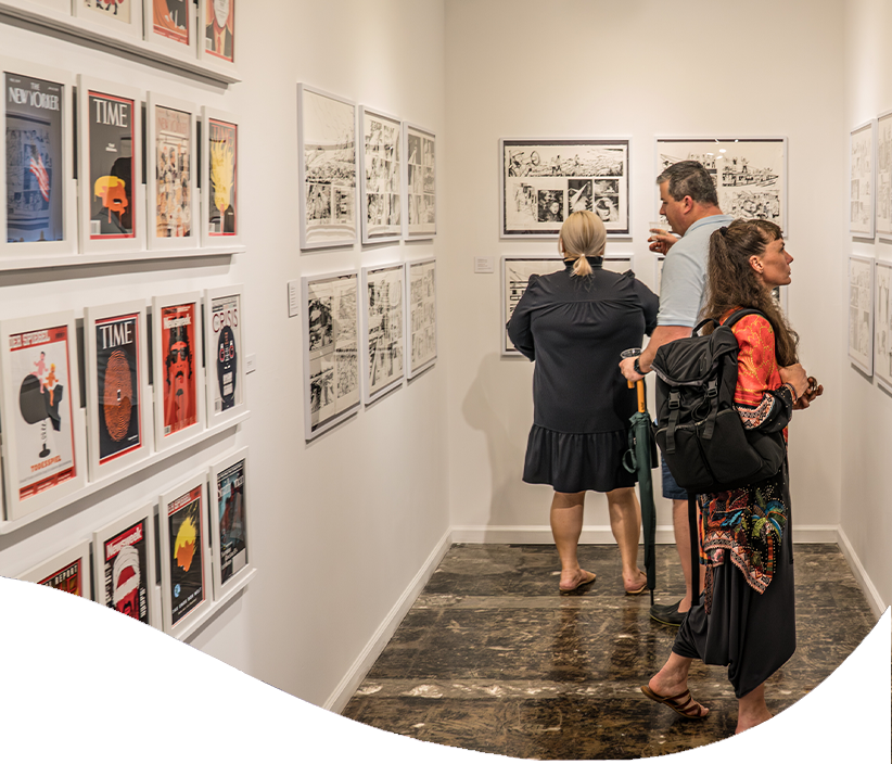 Visitors explore artwork on display in a gallery at The Studios of Key West.