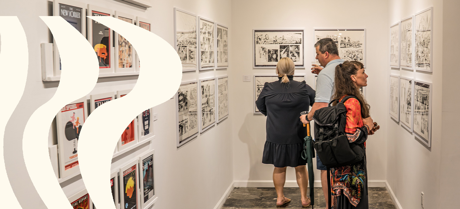 Visitors explore artwork on display in a gallery at The Studios of Key West.
