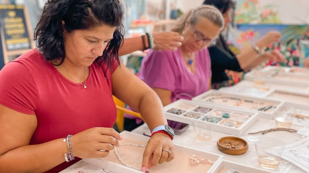 Students select and string colorful beads while creating handmade malas during a jewelry-making class at The Studios of Key West.