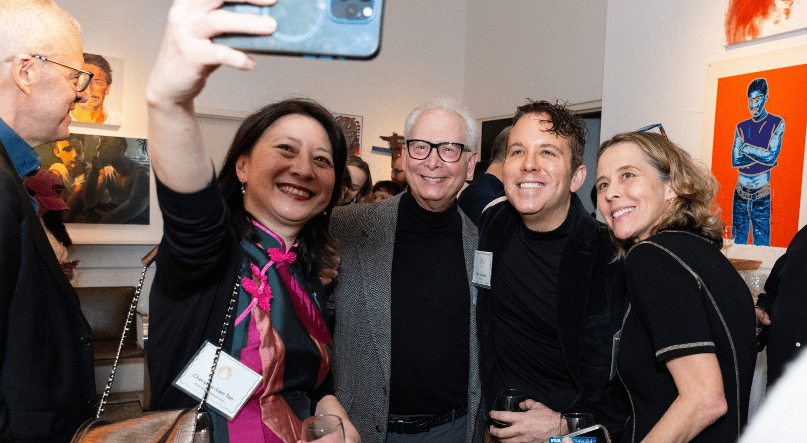 PEAR Alumni Chair Cheryl Lu-Lien Tan takes a selfie with three other guests at a gallery reception in New York.