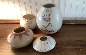 Ceramic vessels with painted geometric figures and patterns by Peyton.